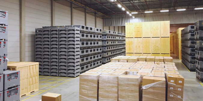 Flextor truck is filled with storage containers and drives down the street